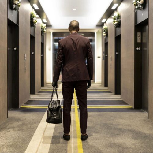 Business owner walking in office corridor